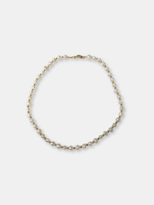 Elegant baroque pearl necklace with an ethereal feel, ideal for brides or vintage-inspired wedding jewelry lovers.