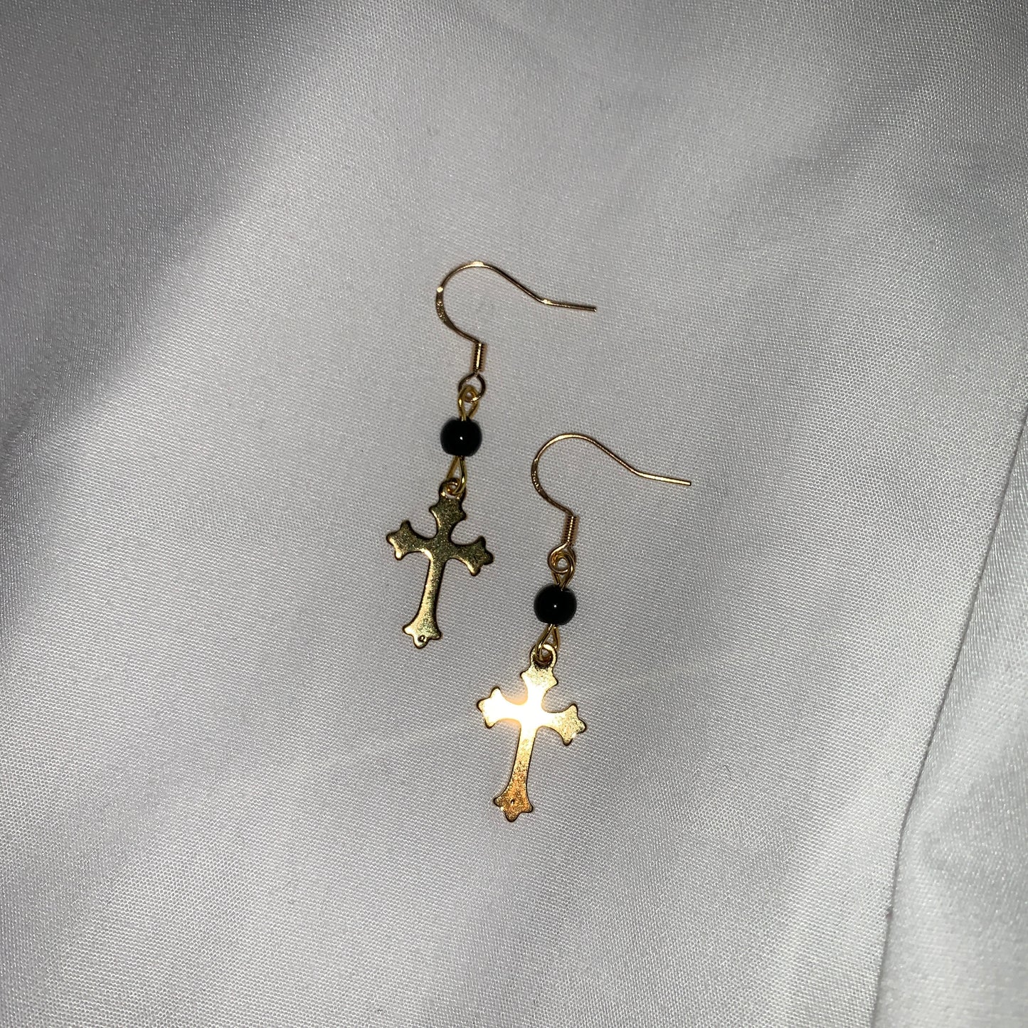 Victorian-inspired gold cross earrings with dark beaded details, ideal for elegant and gothic aesthetics.