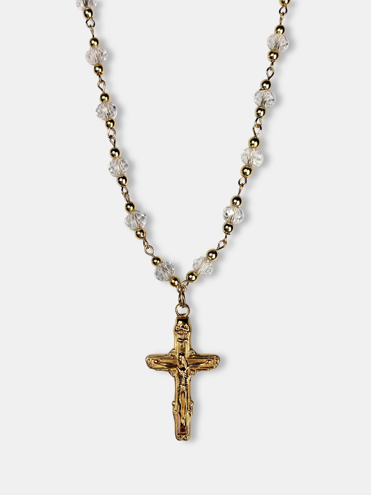 Vintage-inspired gold and crystal bead necklace with a beautifully crafted gold cross pendant, ideal for elegant fashion lovers.