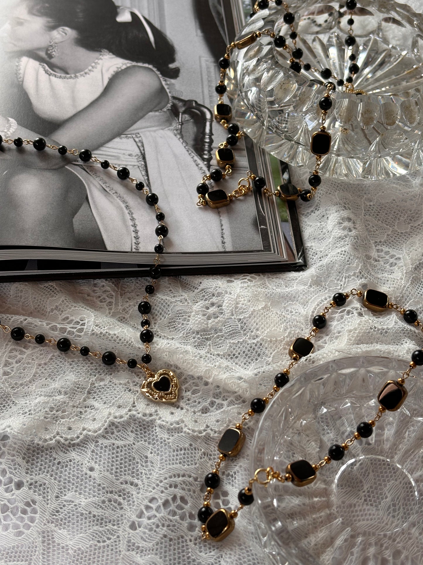 Black onyx and gold-plated choker with square gemstone accents, blending gothic elegance with modern sophistication.