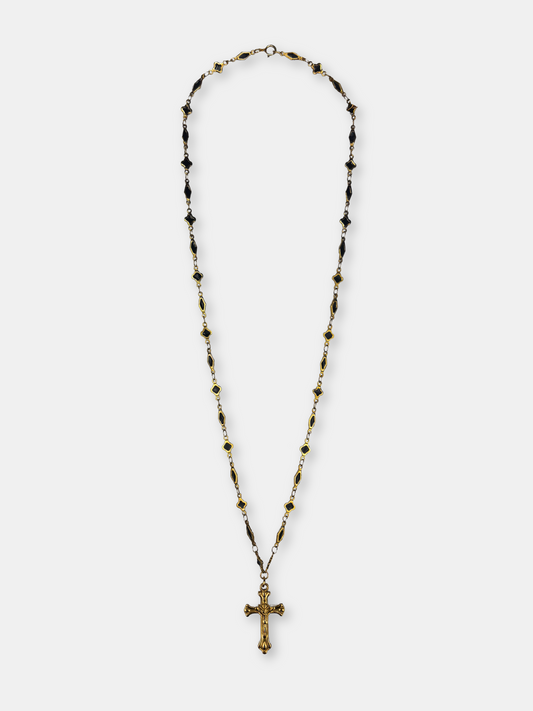 Vintage-inspired gold cross pendant on a delicate long black and gold chain, perfect for gothic and baroque fashion lovers.