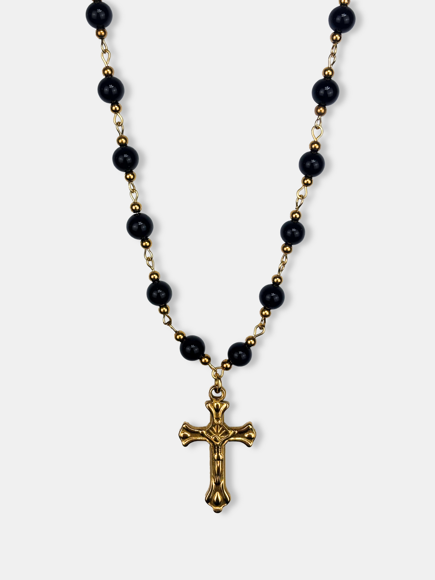Baroque-inspired black bead necklace with a gold cross pendant, ideal for gothic and vintage jewelry lovers.