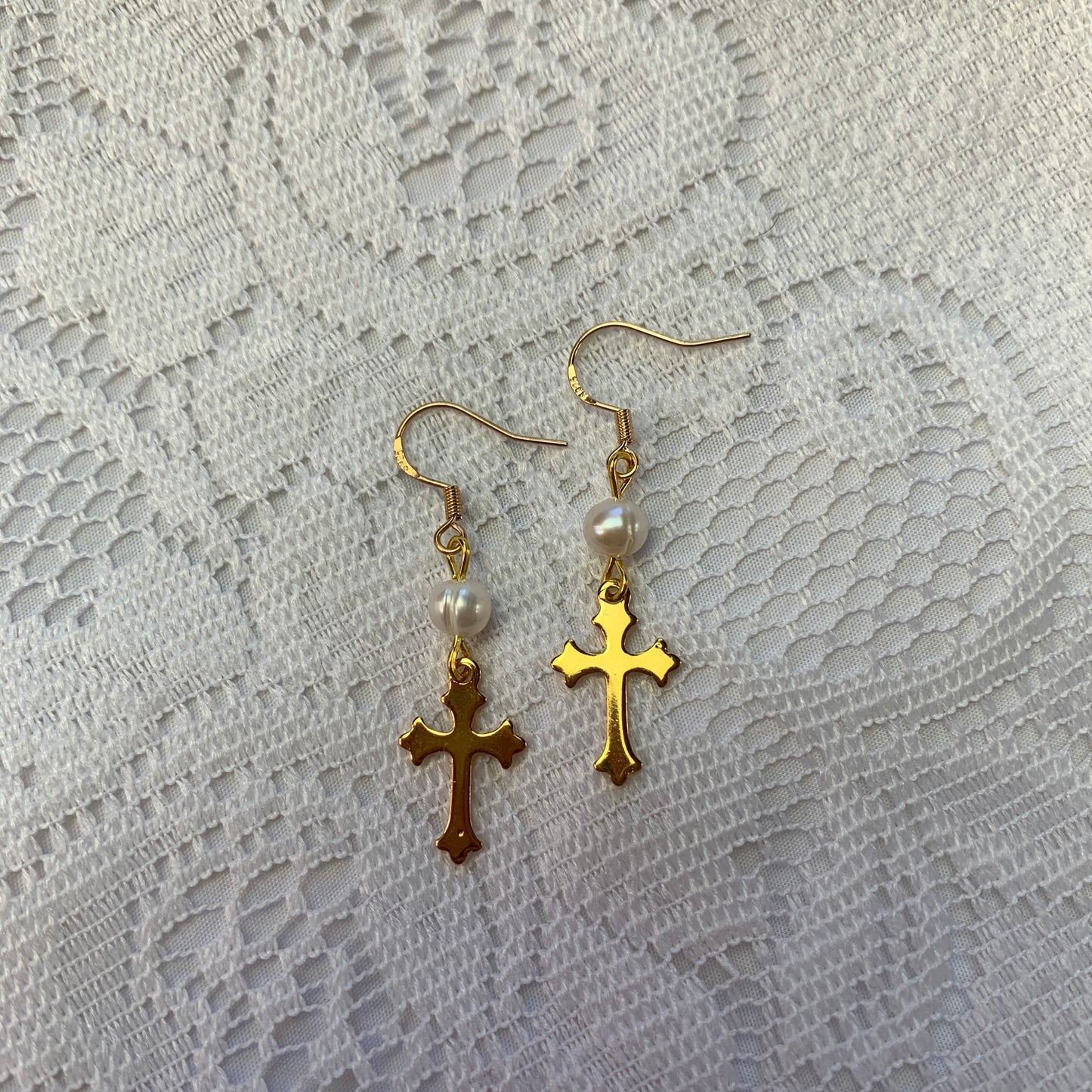 Luxury-inspired gold cross earrings with genuine pearls, perfect for lovers of bold, baroque, and statement jewelry.