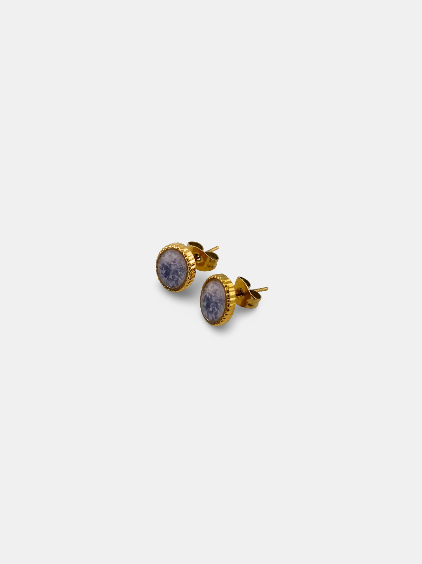 Vintage-inspired stud earrings with a delicate painted rose design.