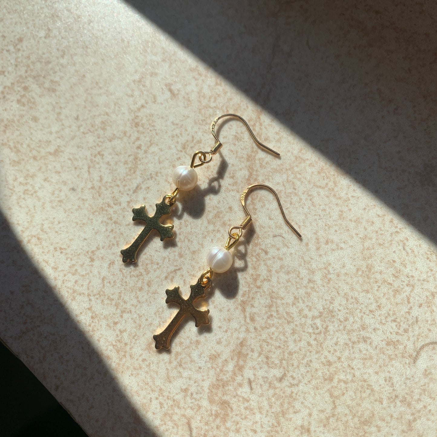 Delicate gold cross earrings with real pearl accents, perfect for baroque and Victorian fashion lovers.