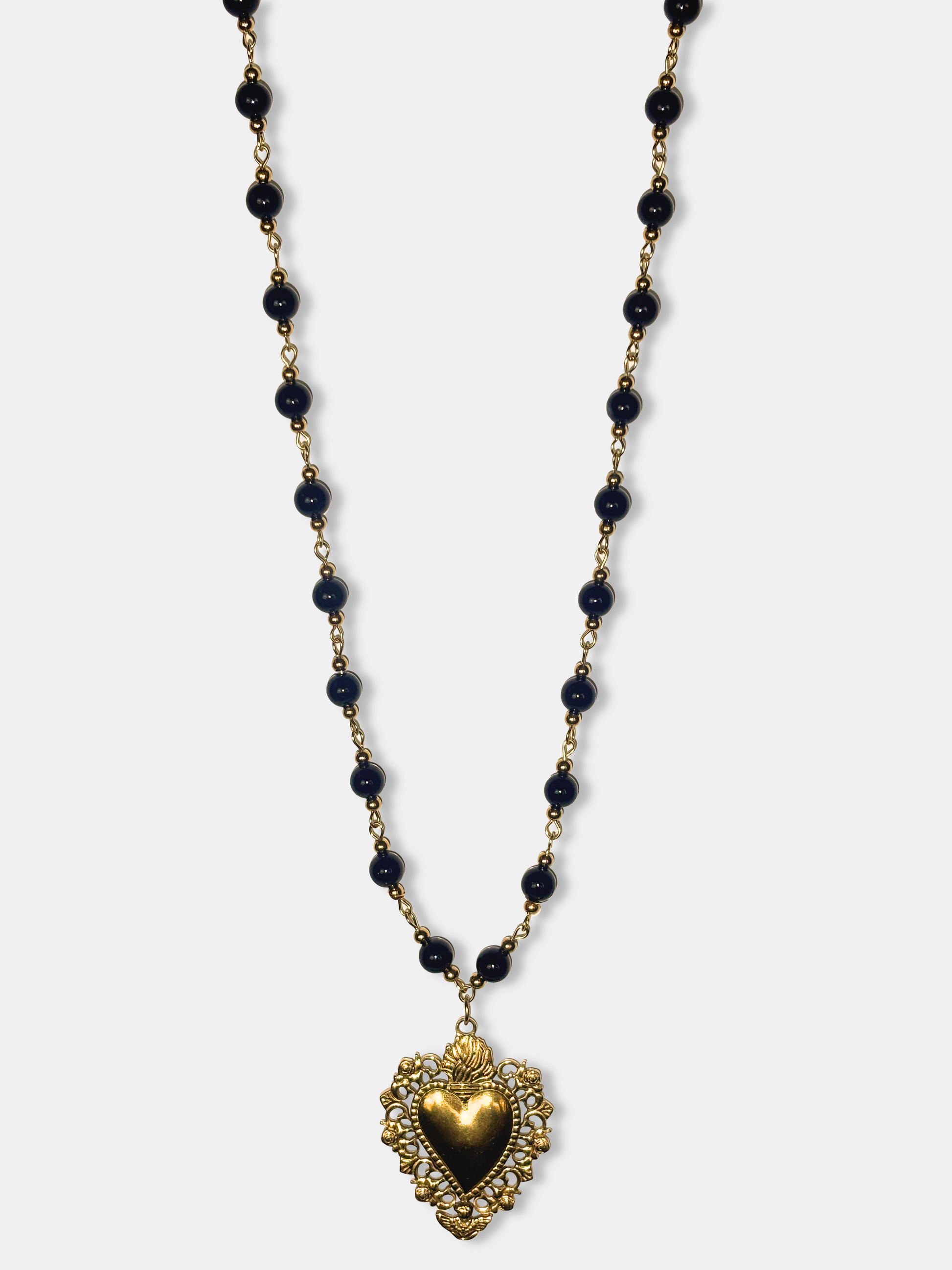 Vintage style gold heart pendant on black bead necklace