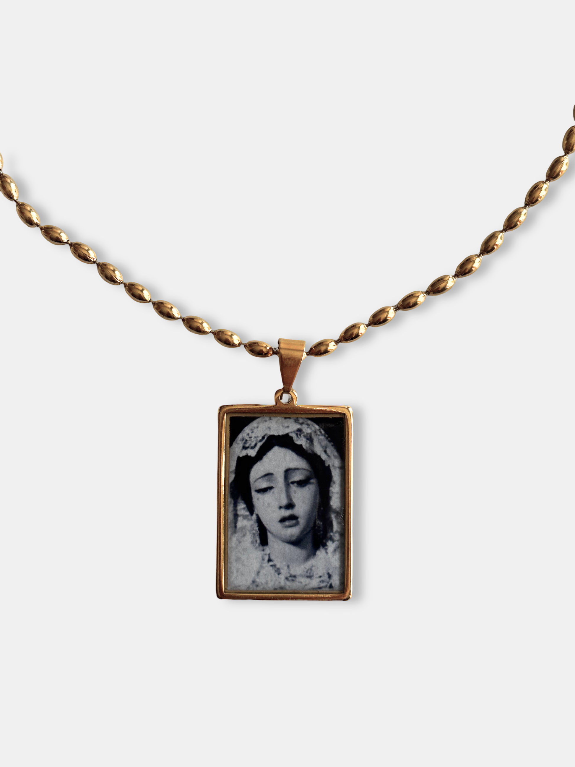 Handmade rectangular pendant with sacred-inspired female face