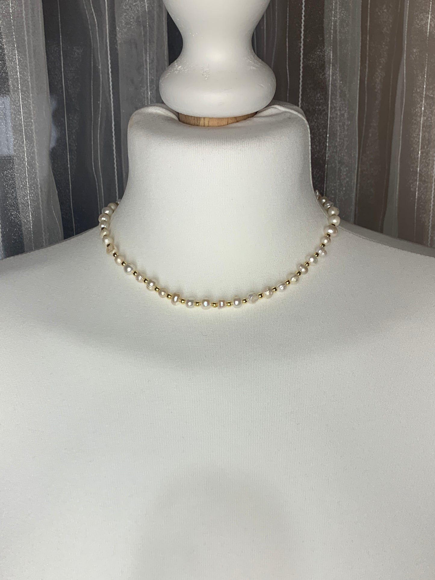 Classic freshwater pearl necklace with a natural, organic shape—perfect for a modern yet timeless bridal look.