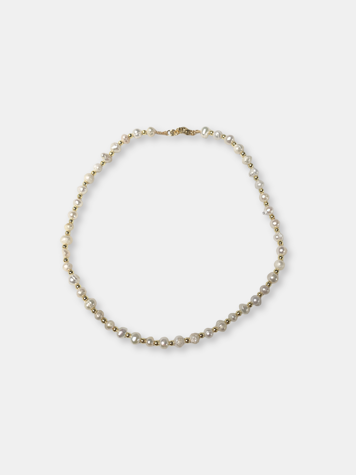 Elegant baroque pearl necklace with an ethereal feel, ideal for brides or vintage-inspired wedding jewelry lovers.