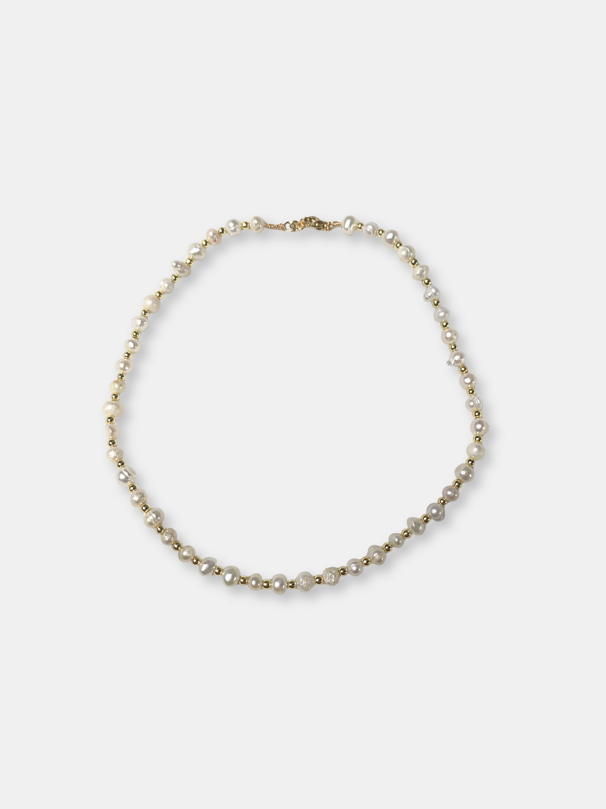 Elegant baroque pearl necklace with an ethereal feel, ideal for brides or vintage-inspired wedding jewelry lovers.