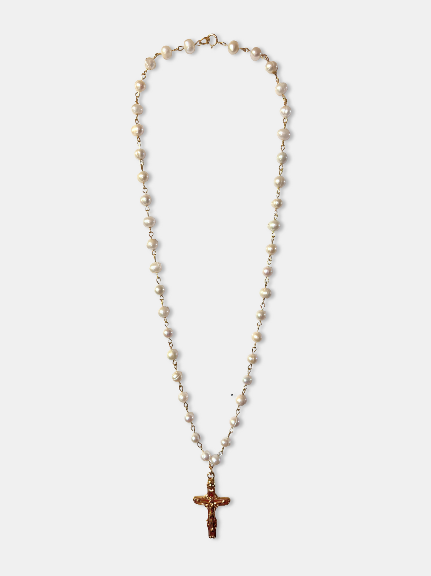 Elegant genuine pearl necklace with gold cross pendant, a perfect blend of gothic and vintage jewelry style.