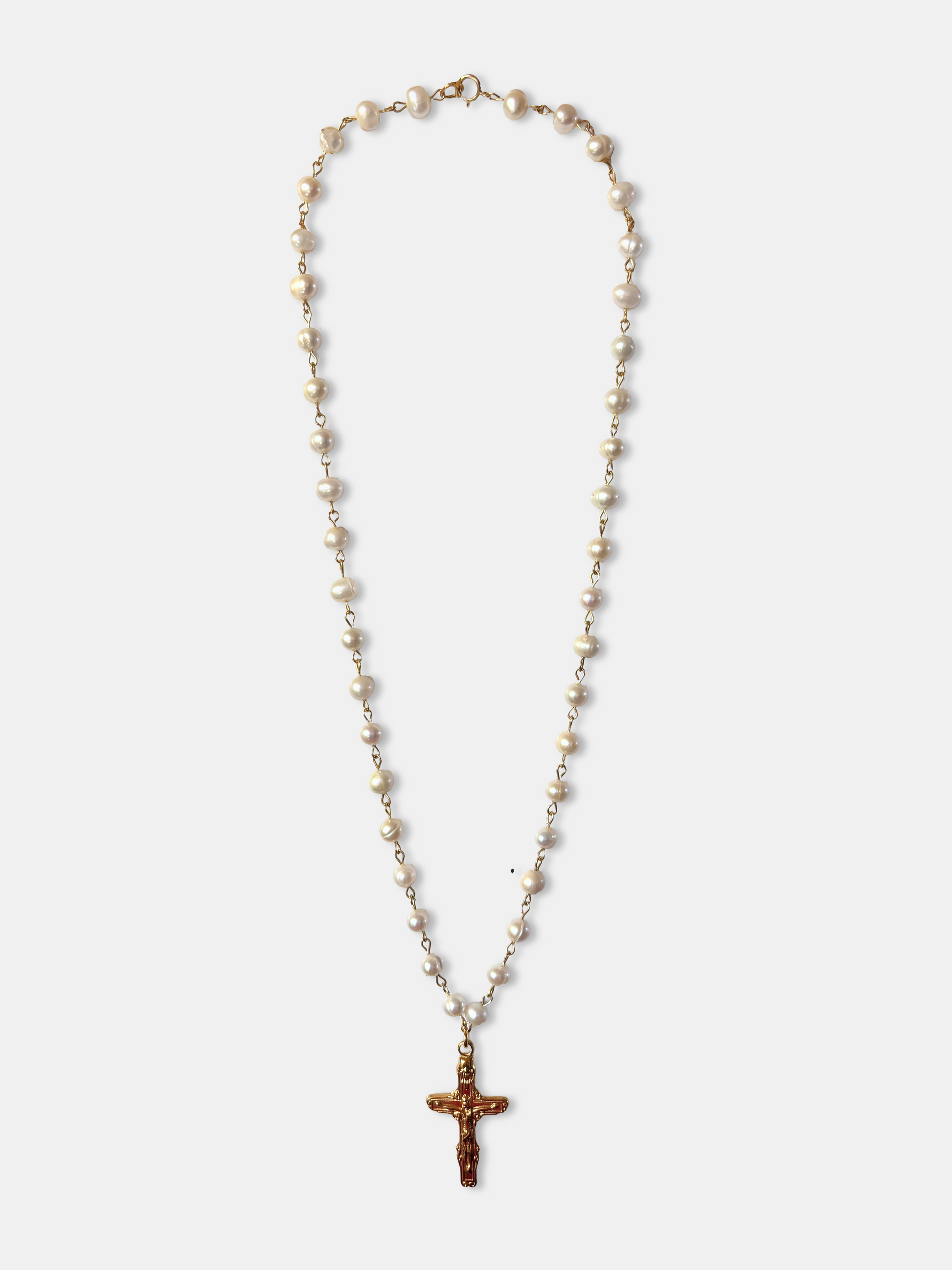 Elegant genuine pearl necklace with gold cross pendant, a perfect blend of gothic and vintage jewelry style.