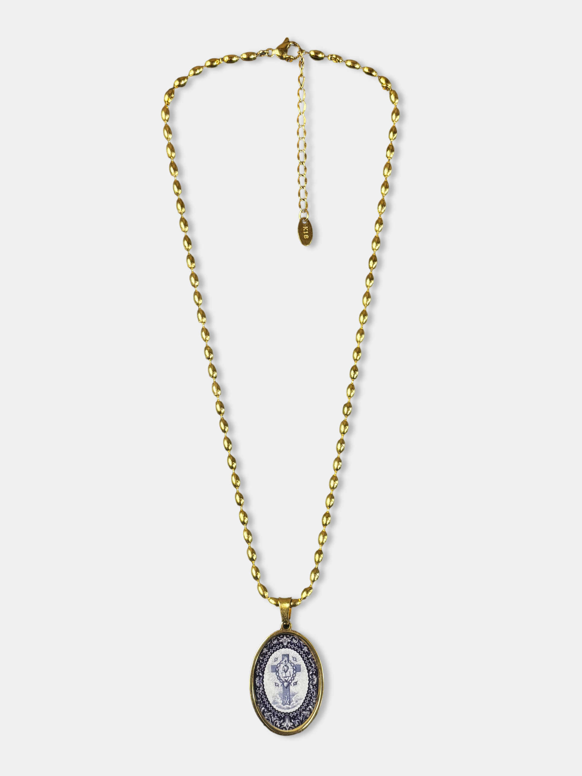 Gold-filled necklace featuring an oval pendant with a symbolic Tree of Life design