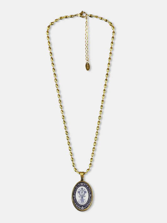 Gold-filled necklace featuring an oval pendant with a symbolic Tree of Life design