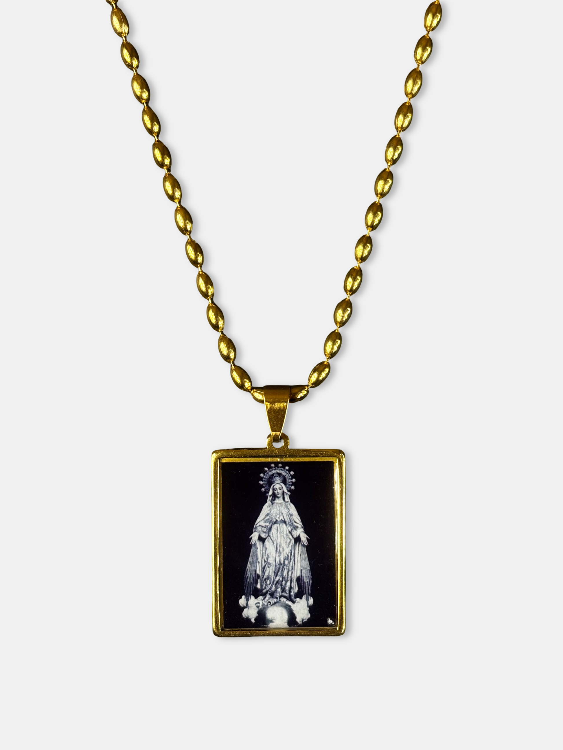 Artistic Mary pendant necklace framed in gold, crafted by an emerging European designer.