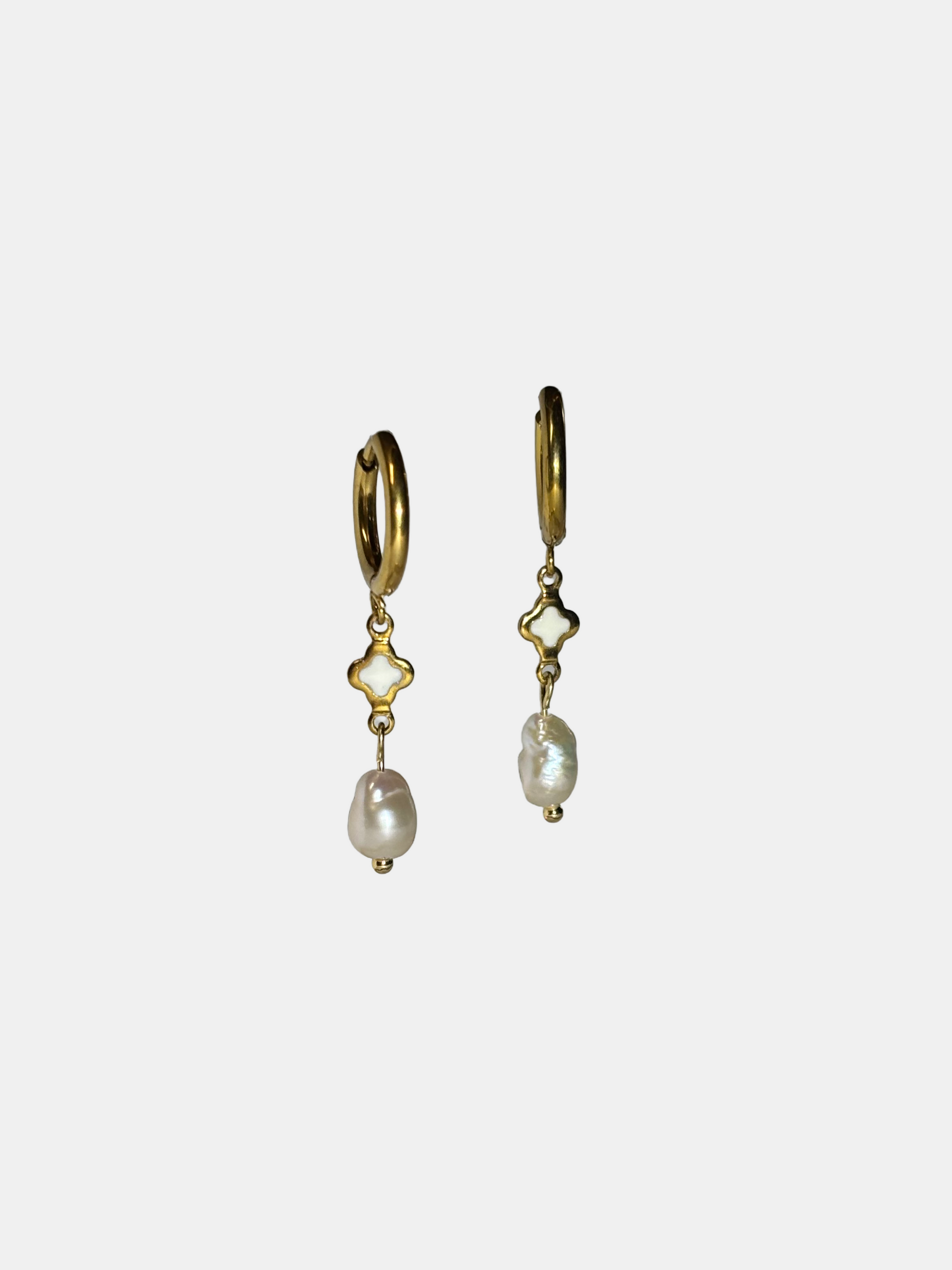 Elegant dangle earrings featuring gold hoops, clover-shaped accents, and real freshwater pearls.