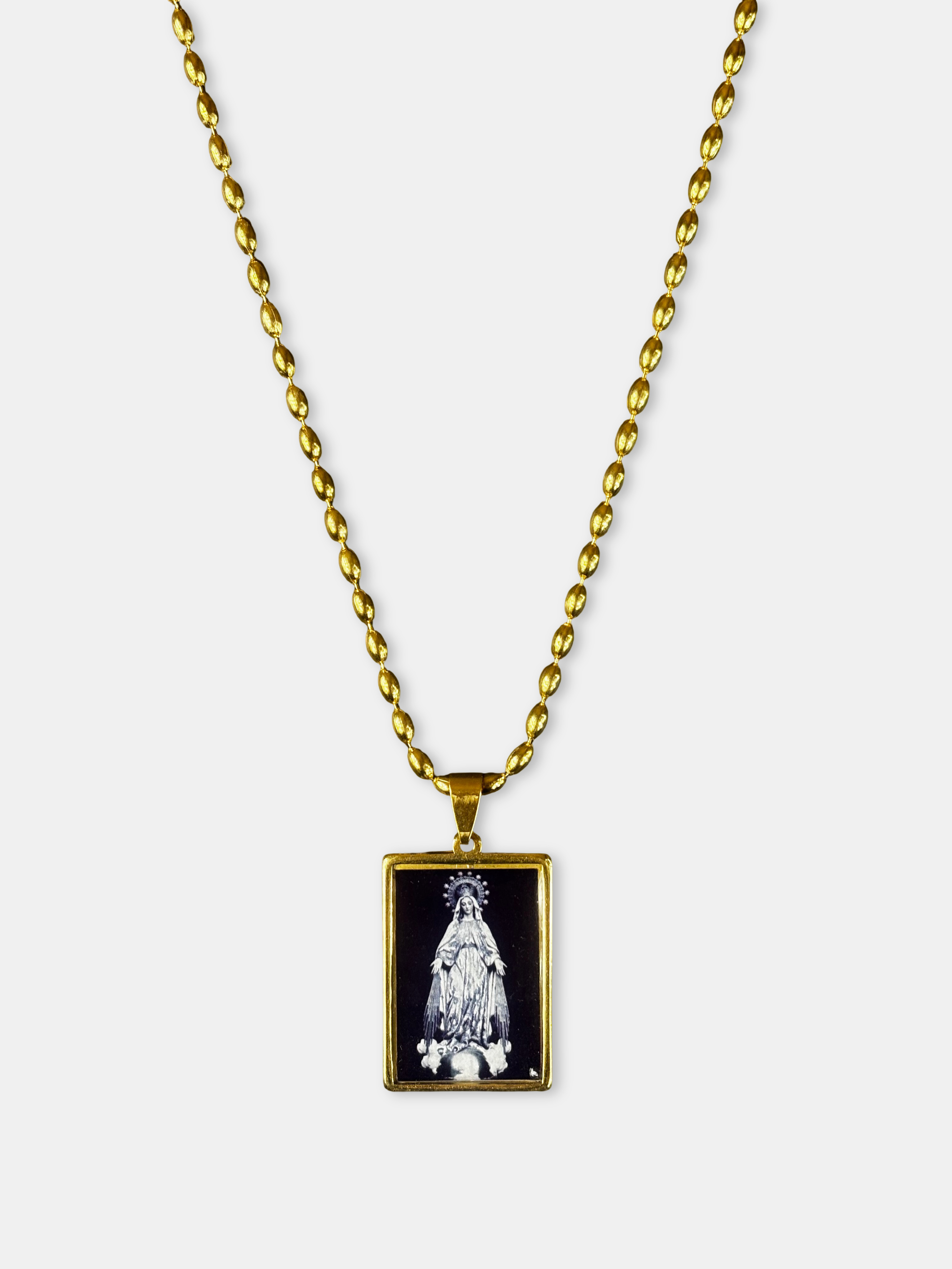 Handmade gold necklace featuring a black rectangular pendant with an image of the Virgin Mary.